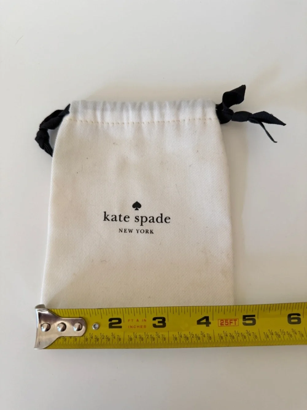 kate spade White Drawstring Logo Pouch with Black Ribbon